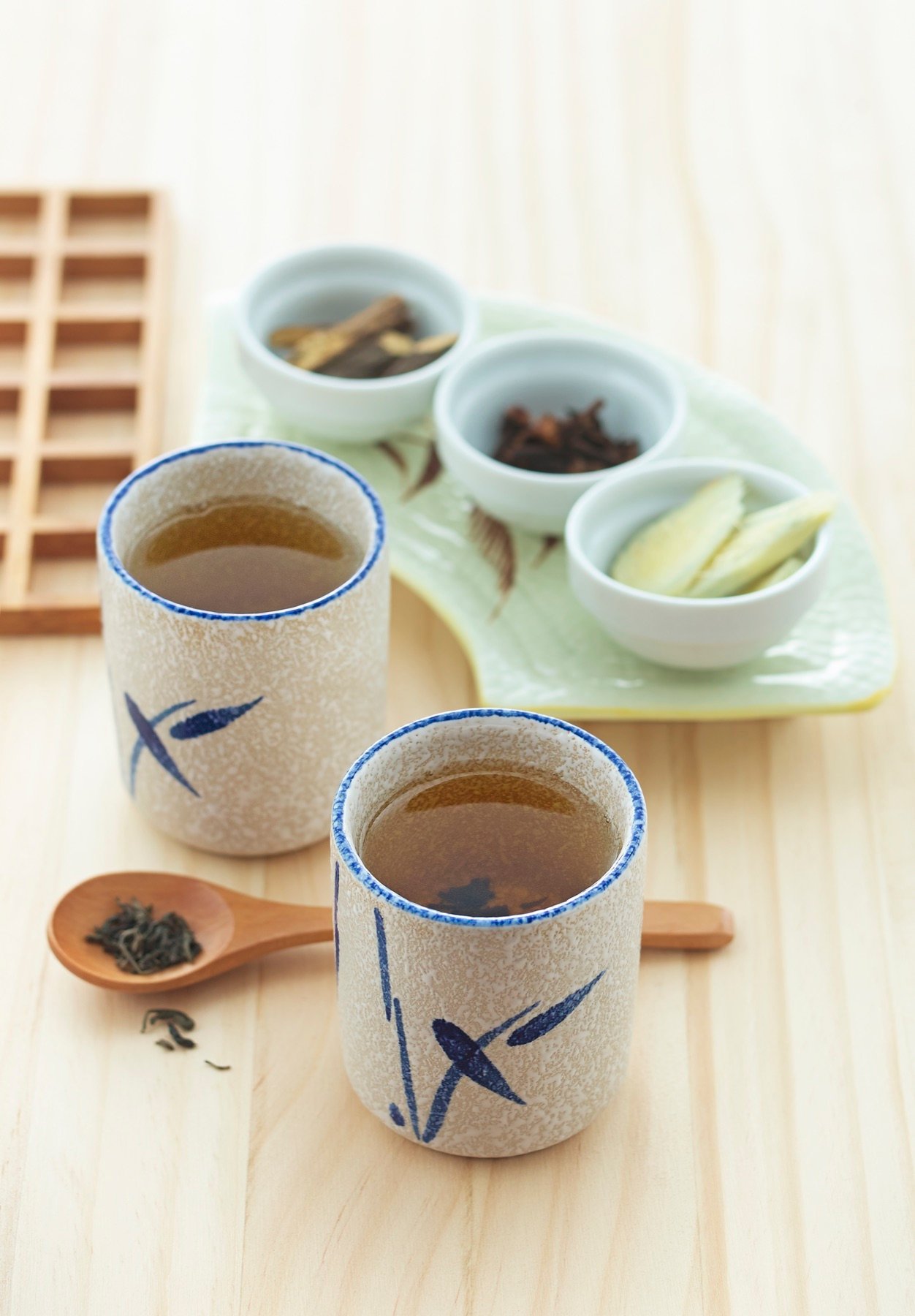 A tea service arranged with small cups