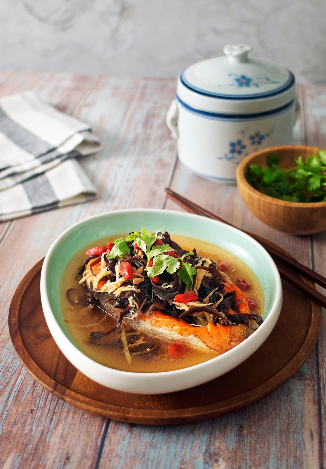 A warm bowl of soup with fresh herbs
