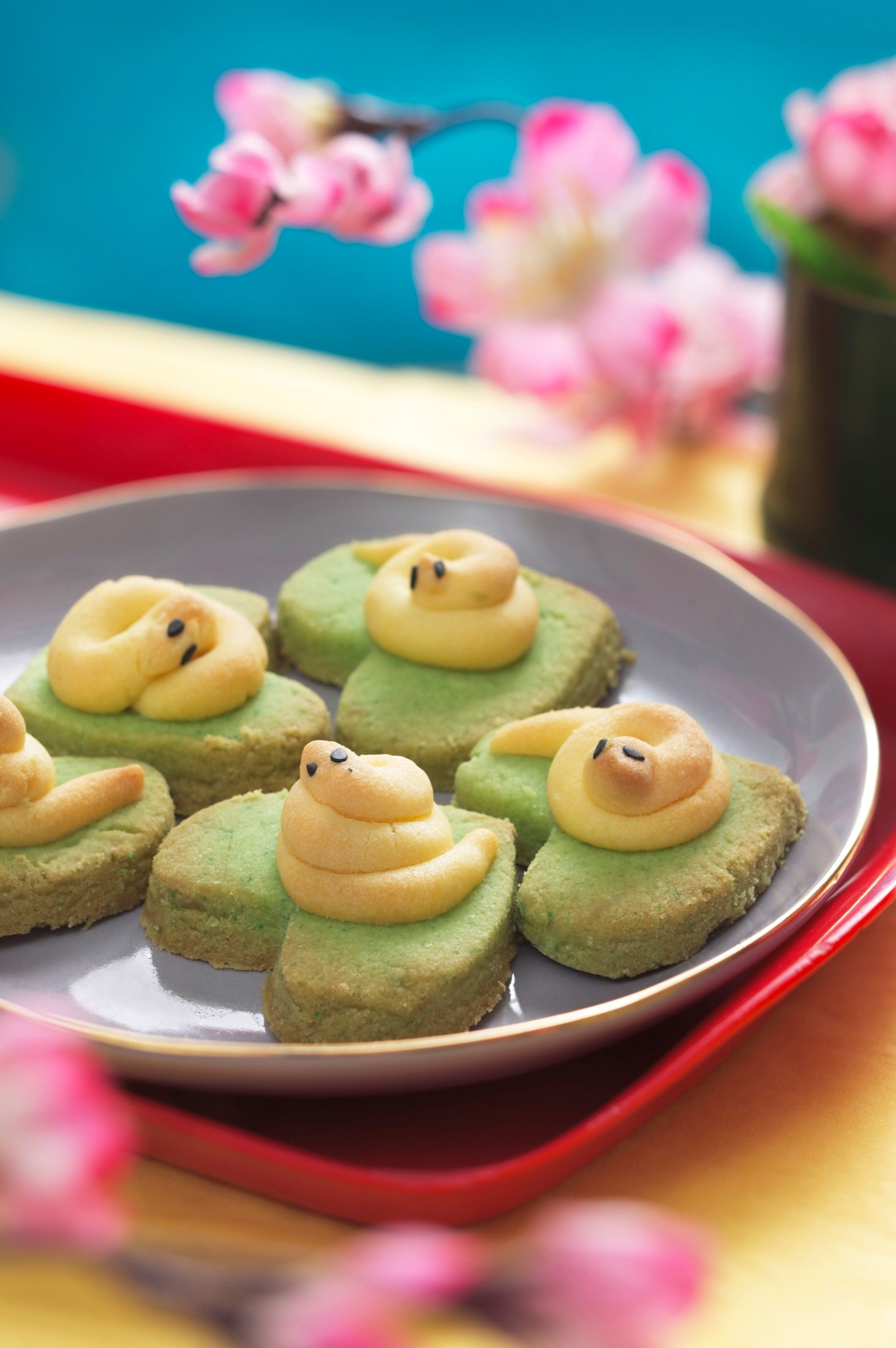 Green tea pastries styled with flowers