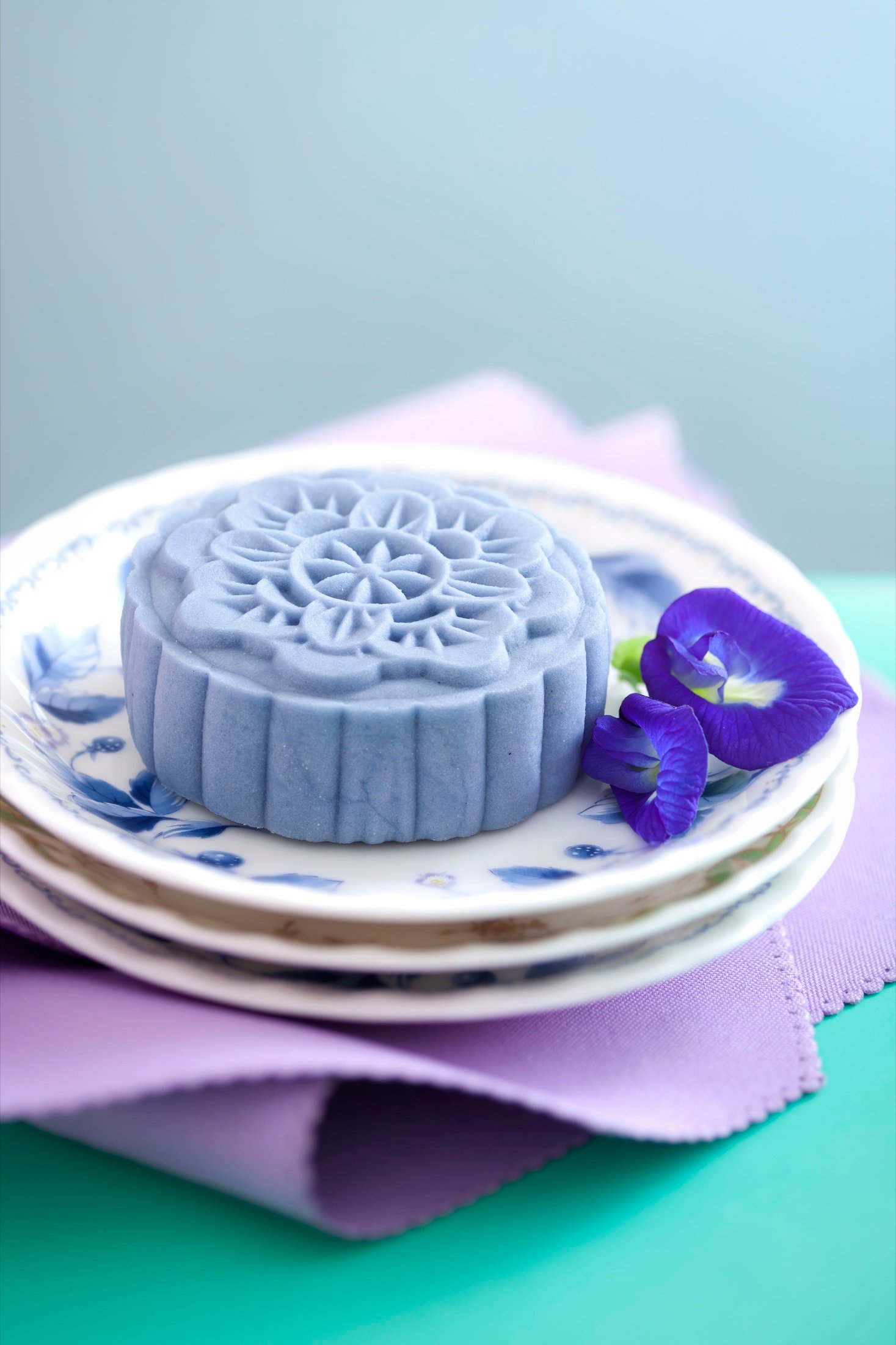 A mooncake presented on a blue plate
