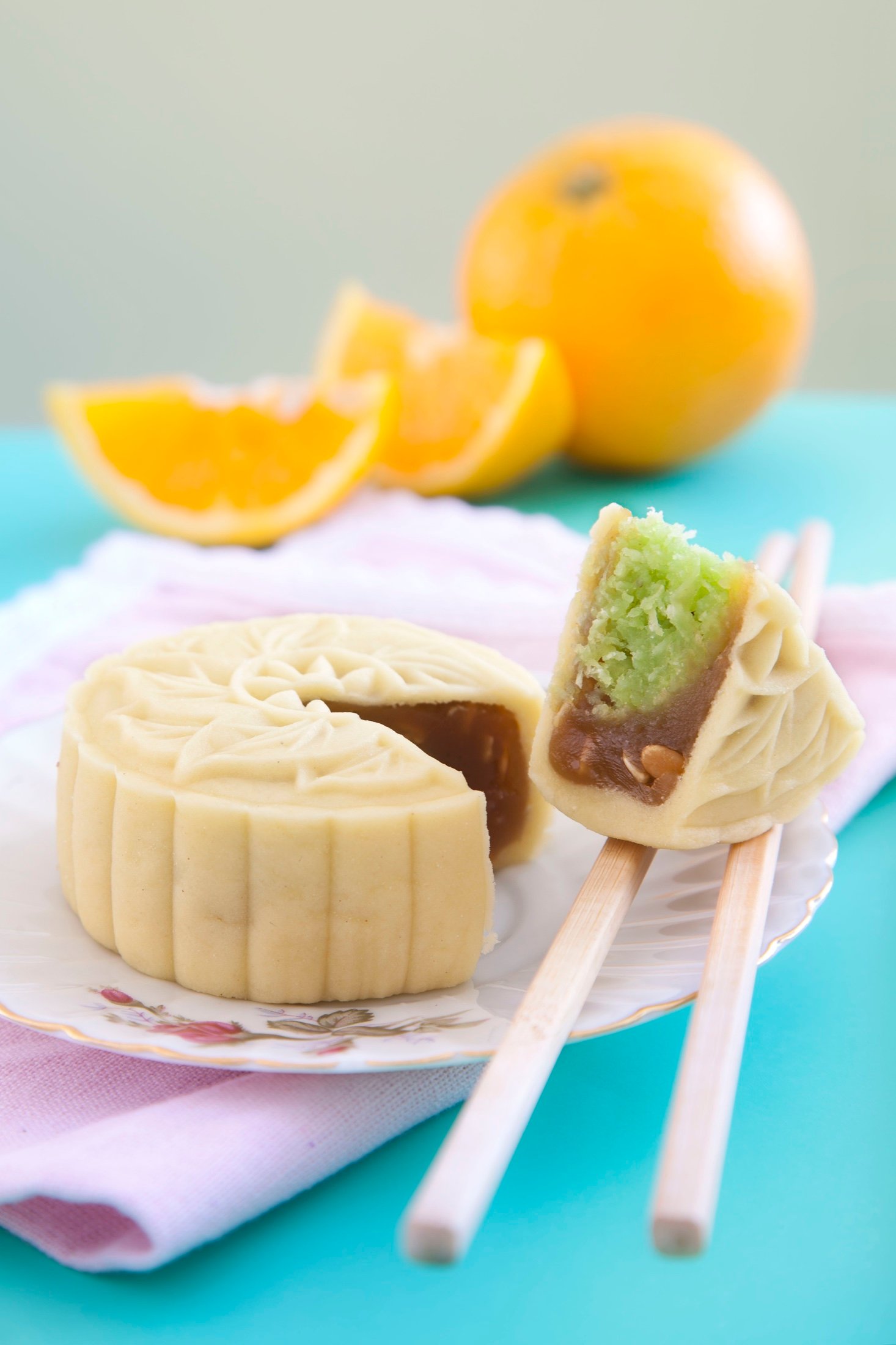 Mooncake styled with orange and pastry