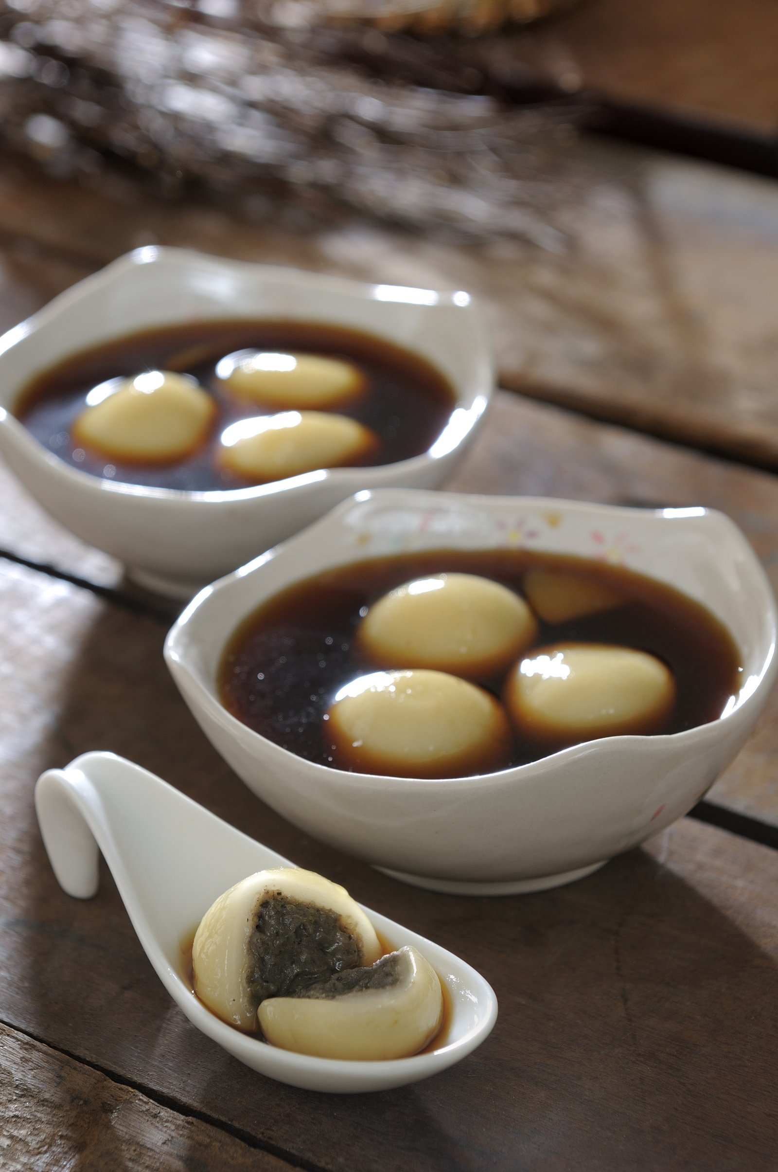 Sweet rice dumplings served in bowls of syrup