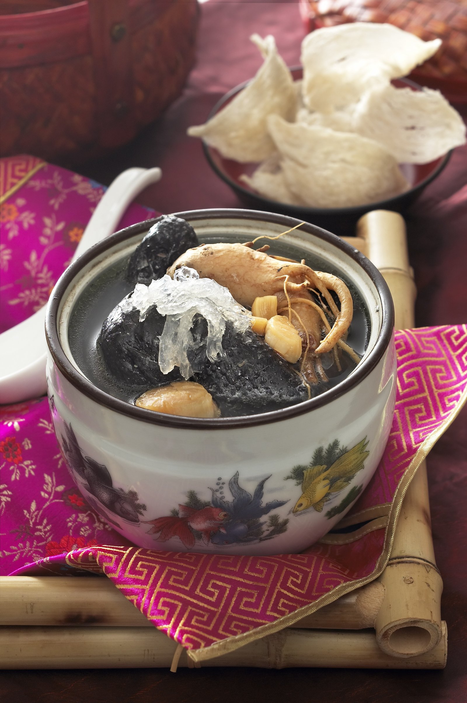 A traditional herbal soup served in a ceramic pot