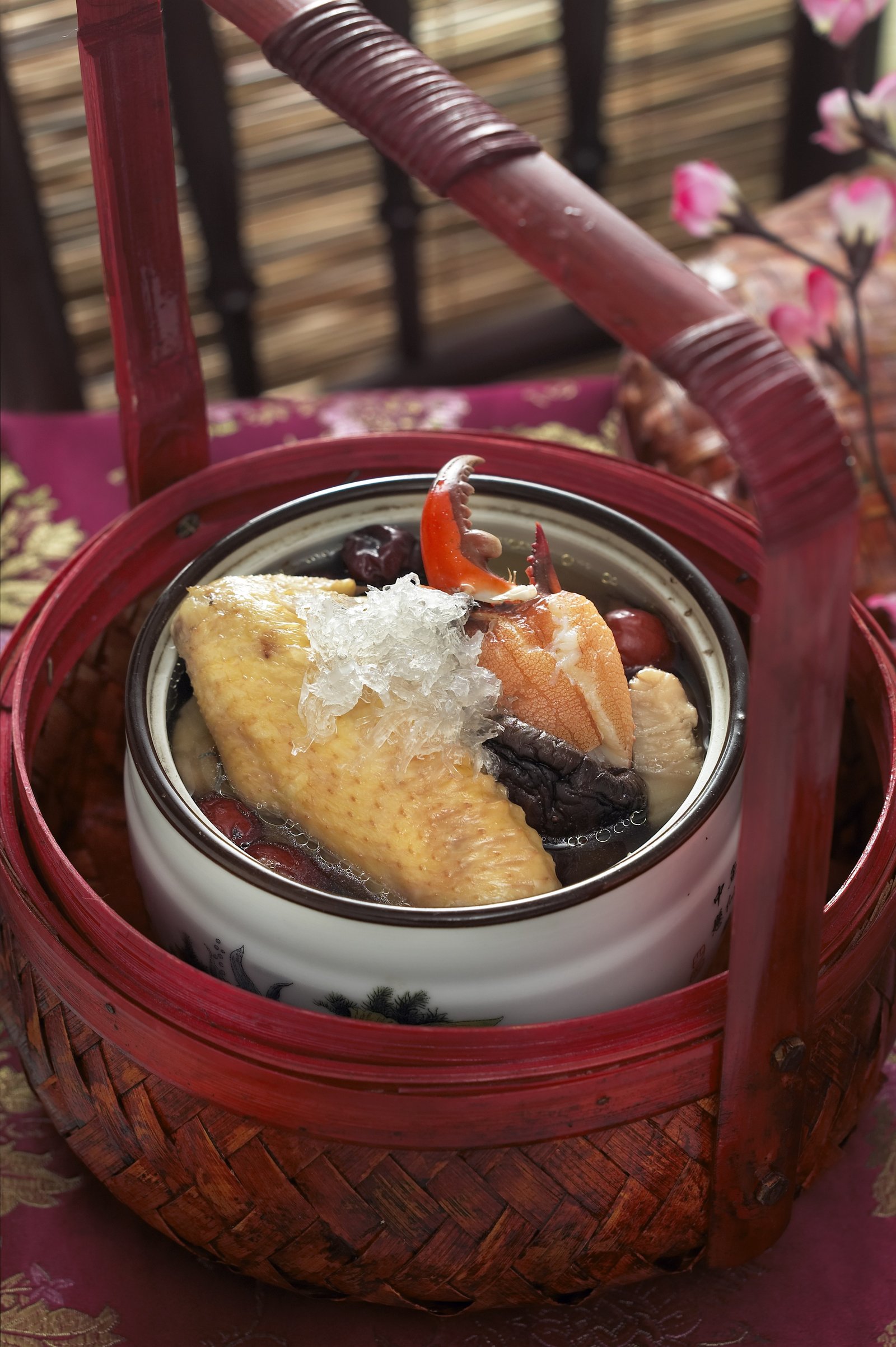 A traditional chicken dish presented in a woven basket