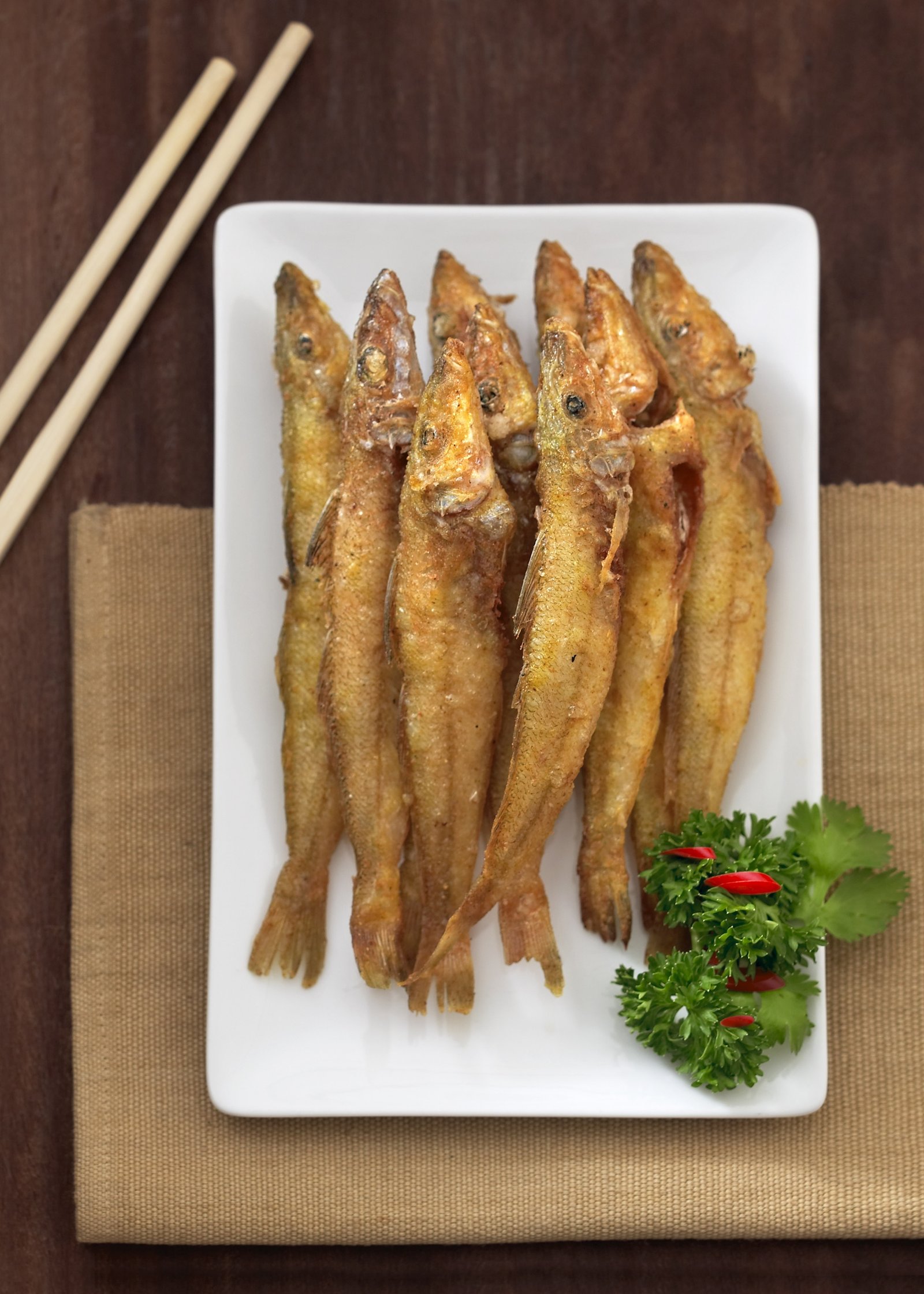 Crisp fried fish served with fresh garnish