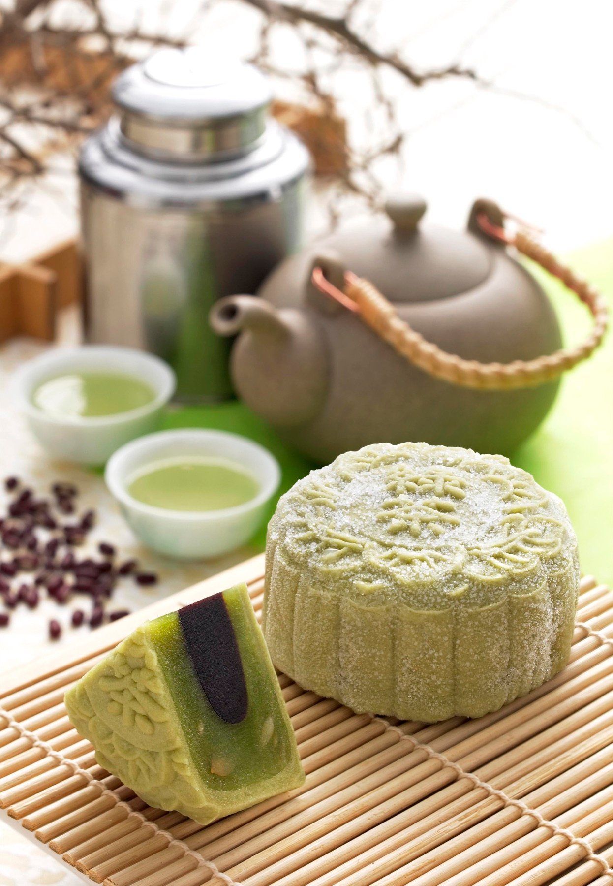 Green tea desserts arranged with tea service