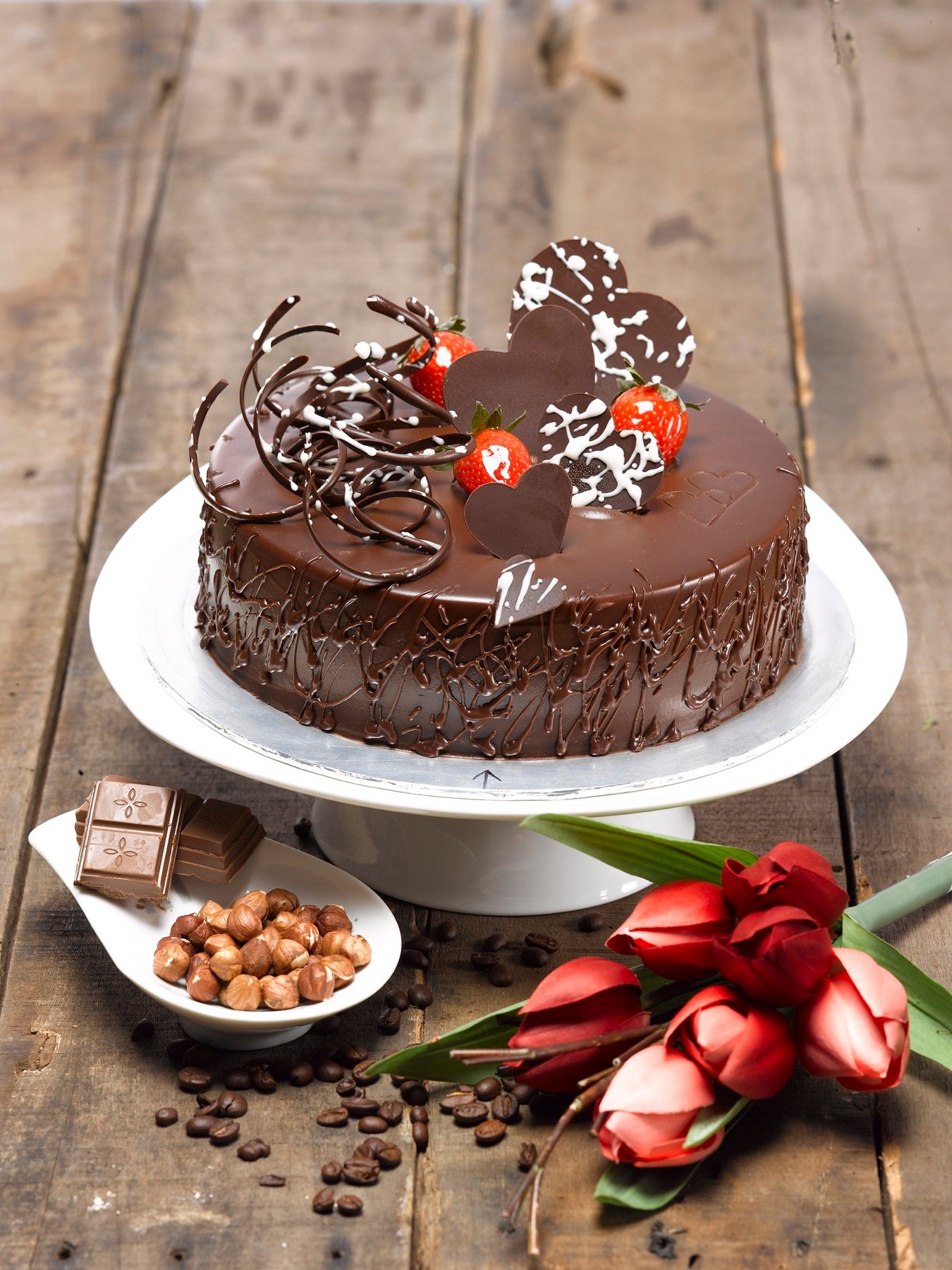 A chocolate cake styled with berries