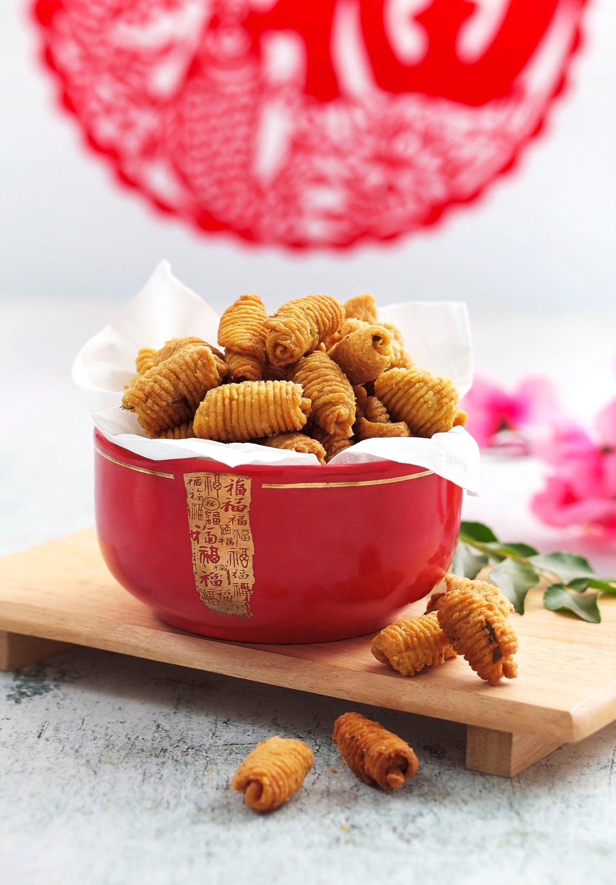 Colourful pastries served in a red bowl