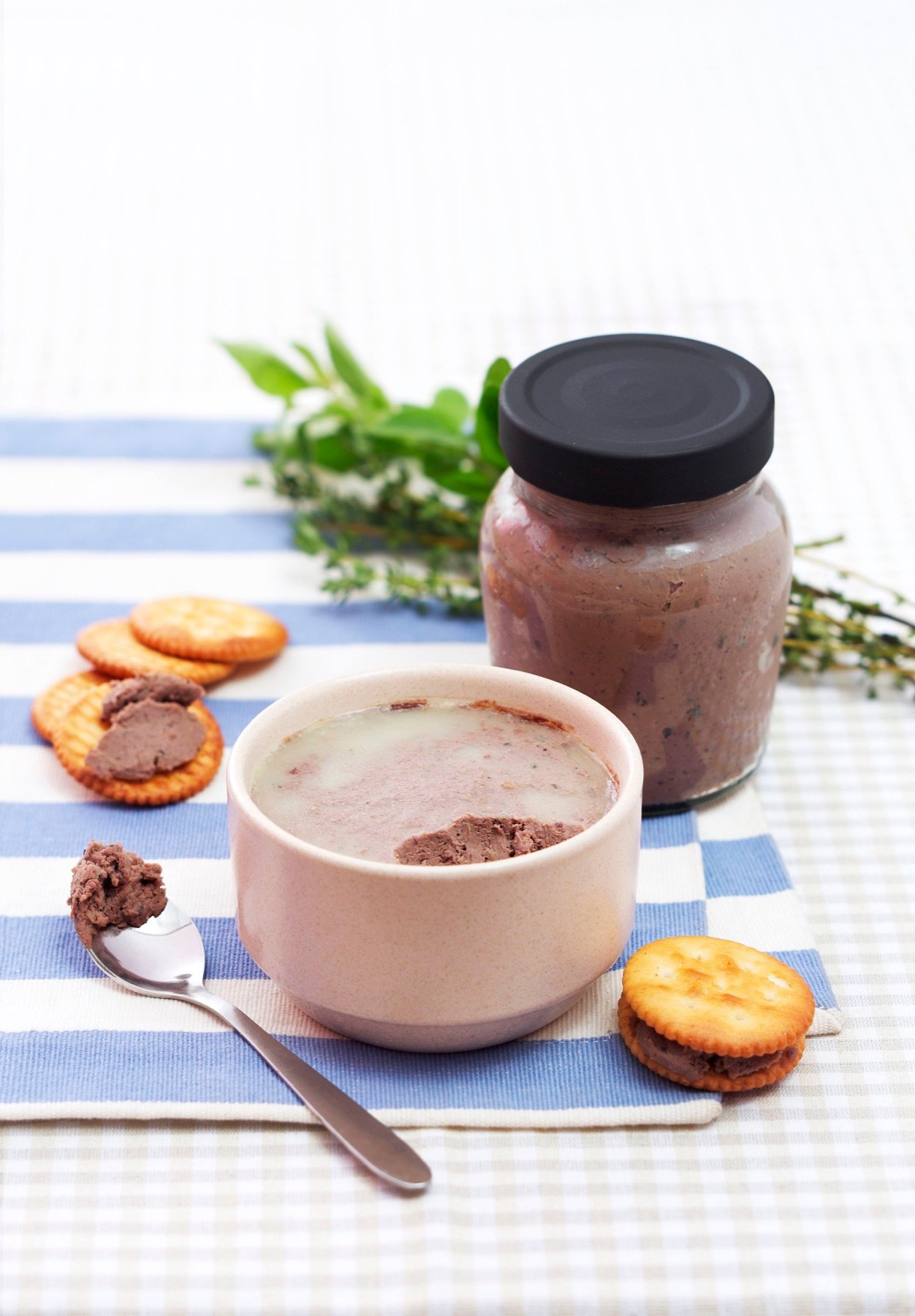 A jar of savoury snacks served with biscuits