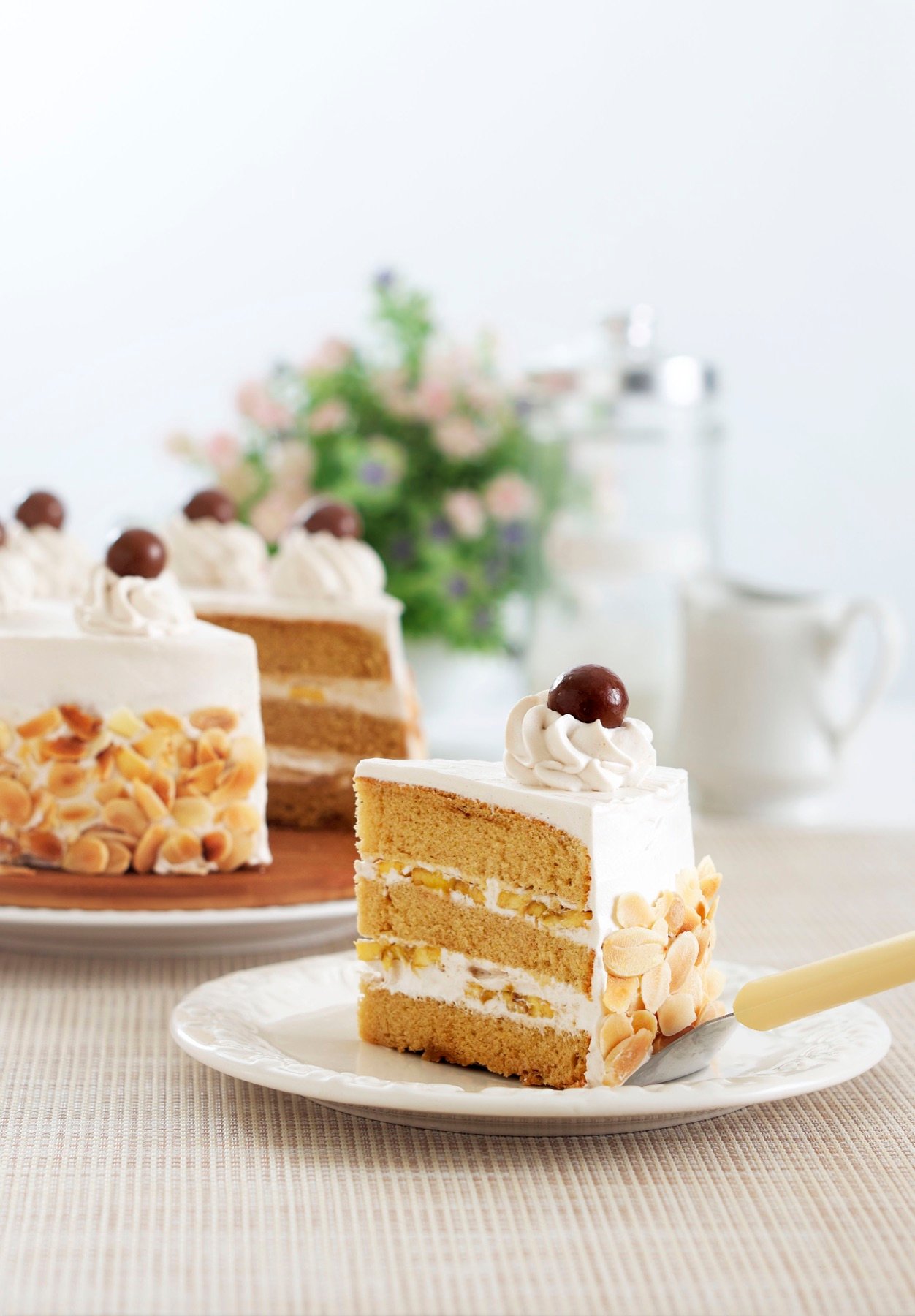 A slice of cake plated with berries