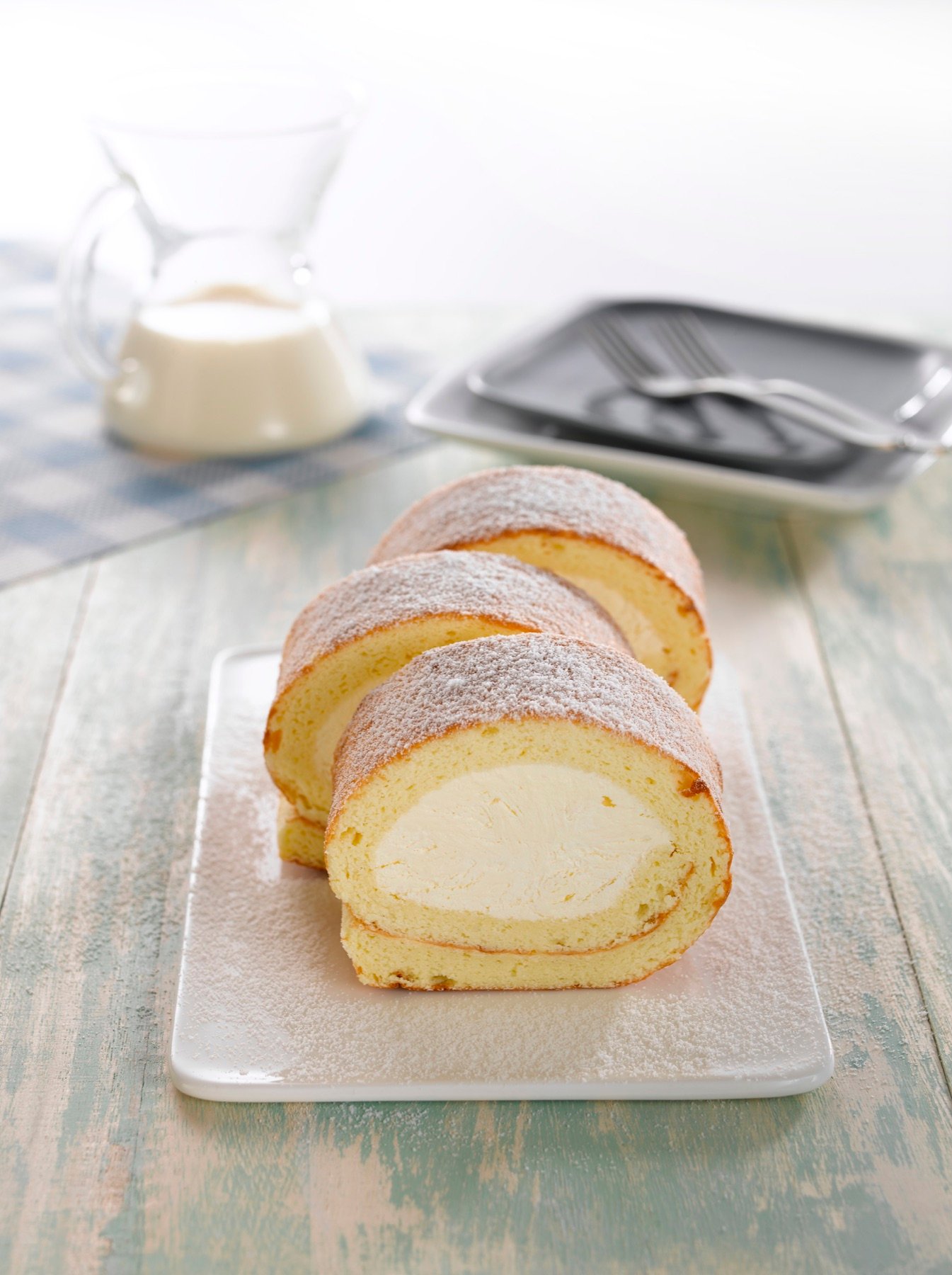 A sliced sponge roll arranged for a bakery menu