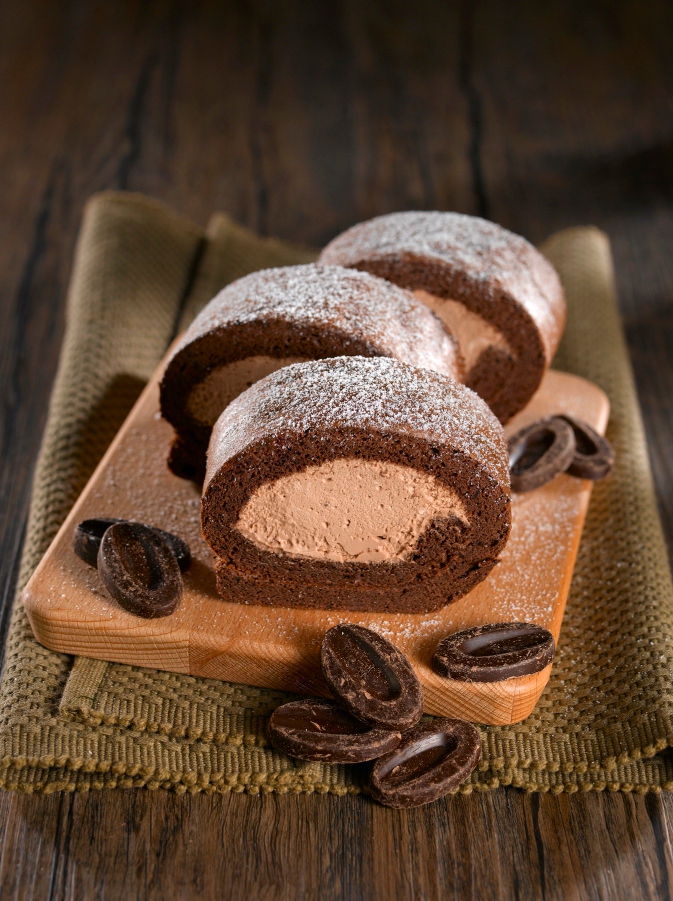 Rustic loaves of bread styled on a wooden board