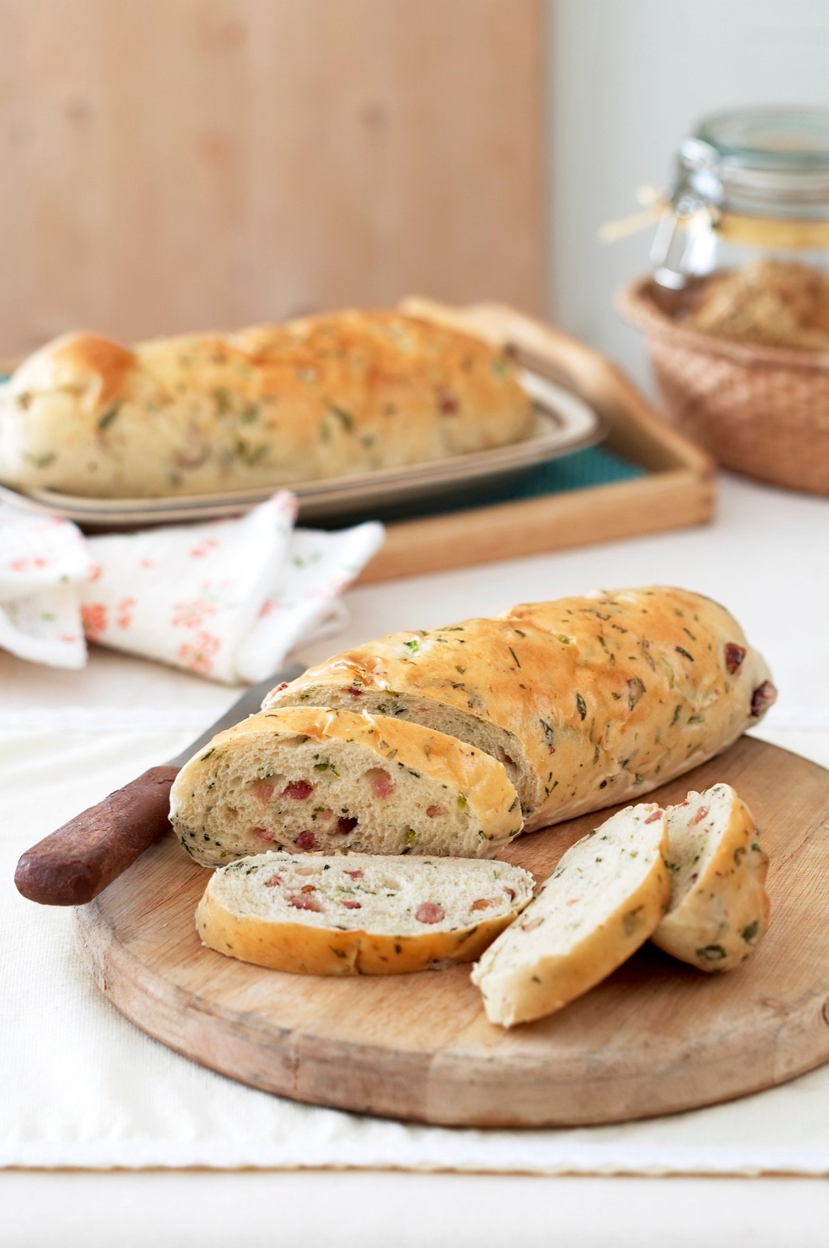 A freshly baked sandwich loaf served on a board