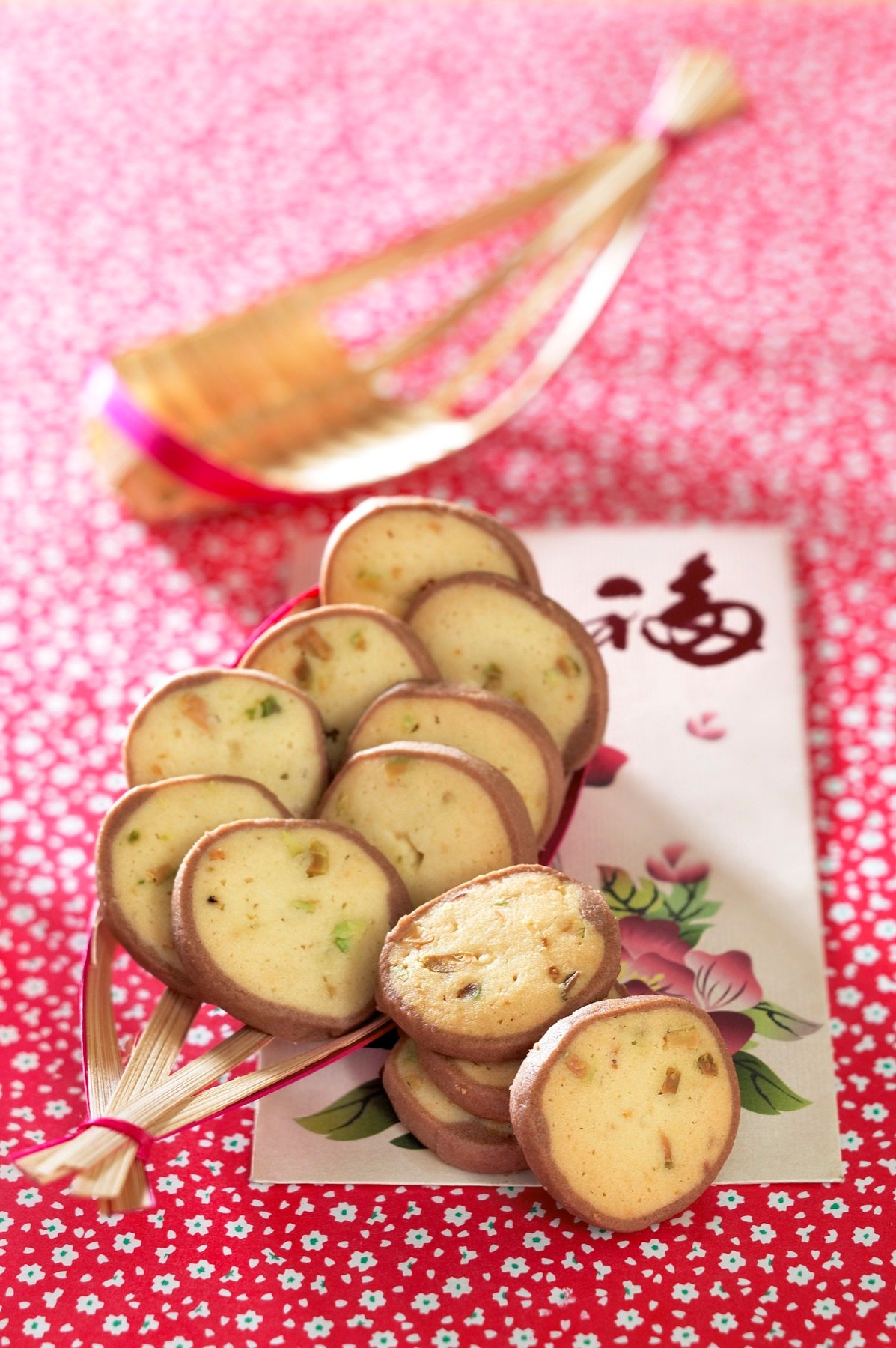 Small pastries arranged on a pink surface