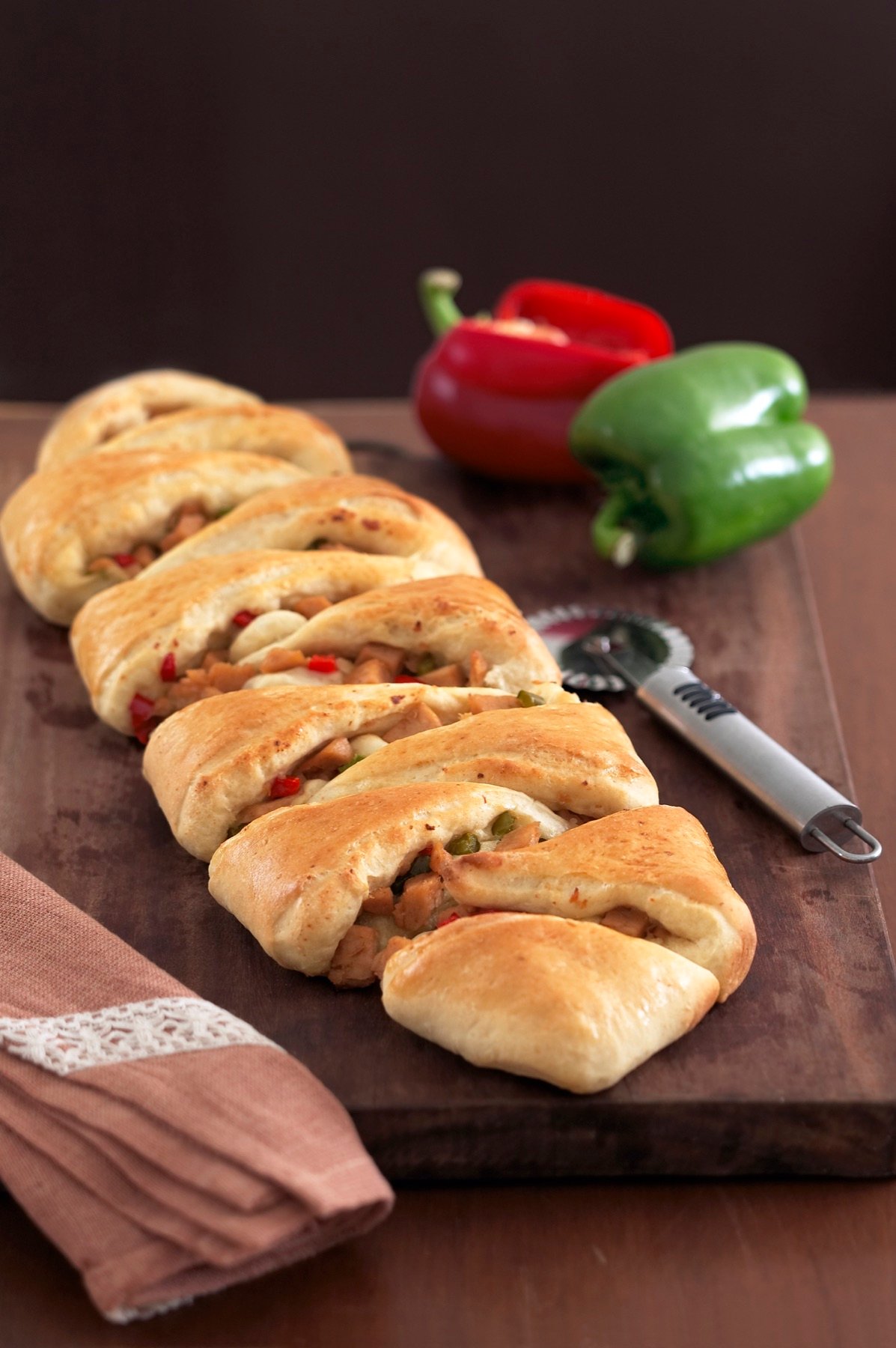 Golden baked rolls arranged on a board