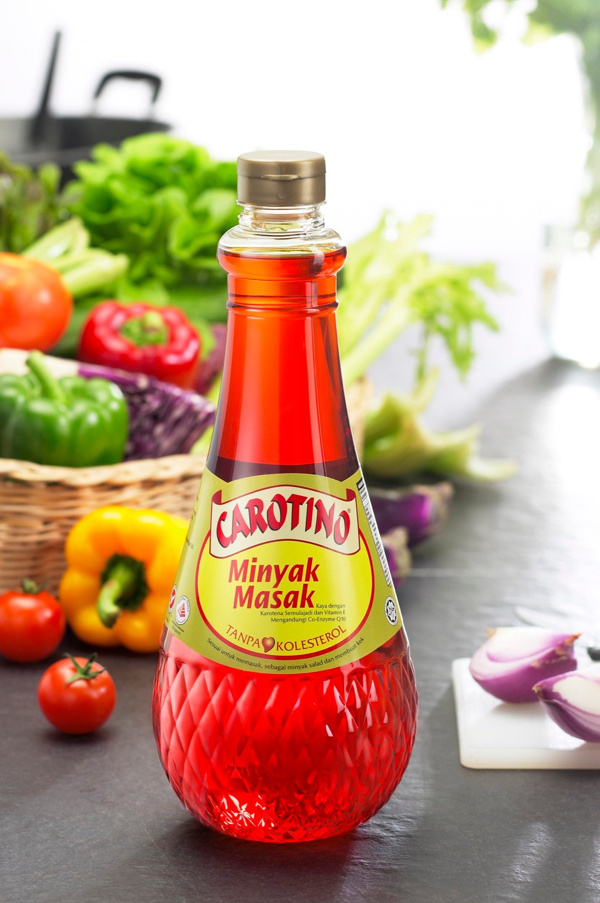 A bottled chilli sauce styled with fresh vegetables
