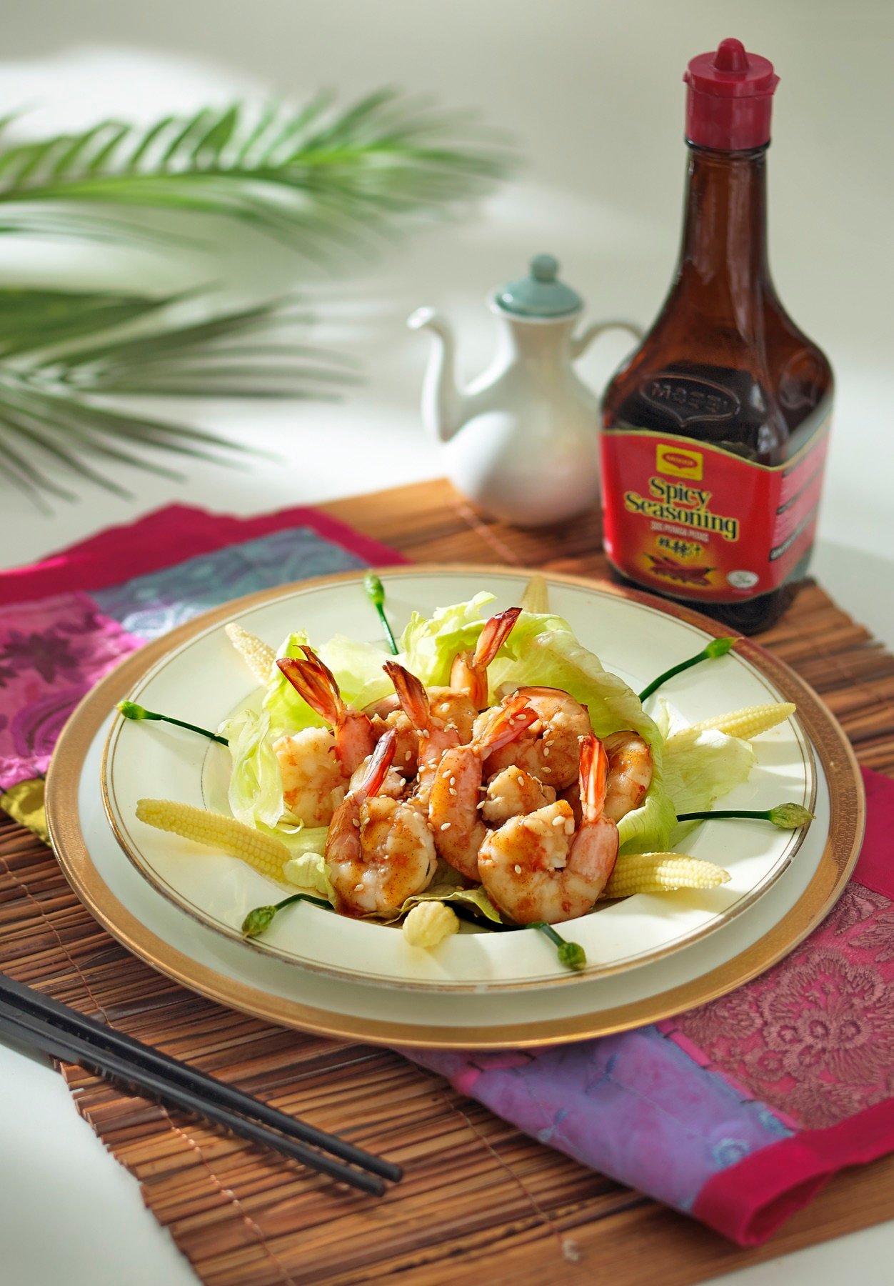 A sauce bottle styled beside a plated meal
