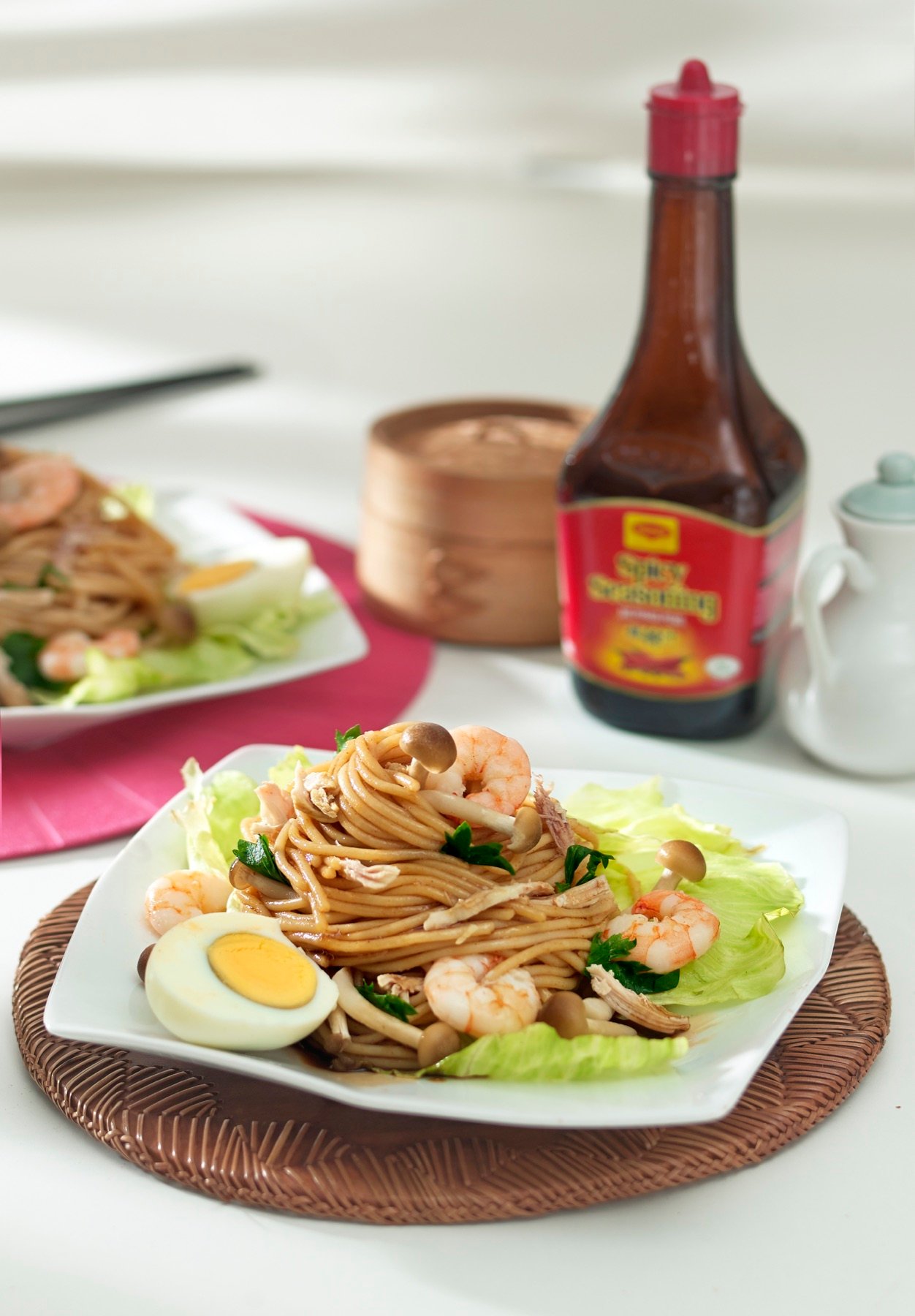 A packaged sauce presented with a restaurant dish