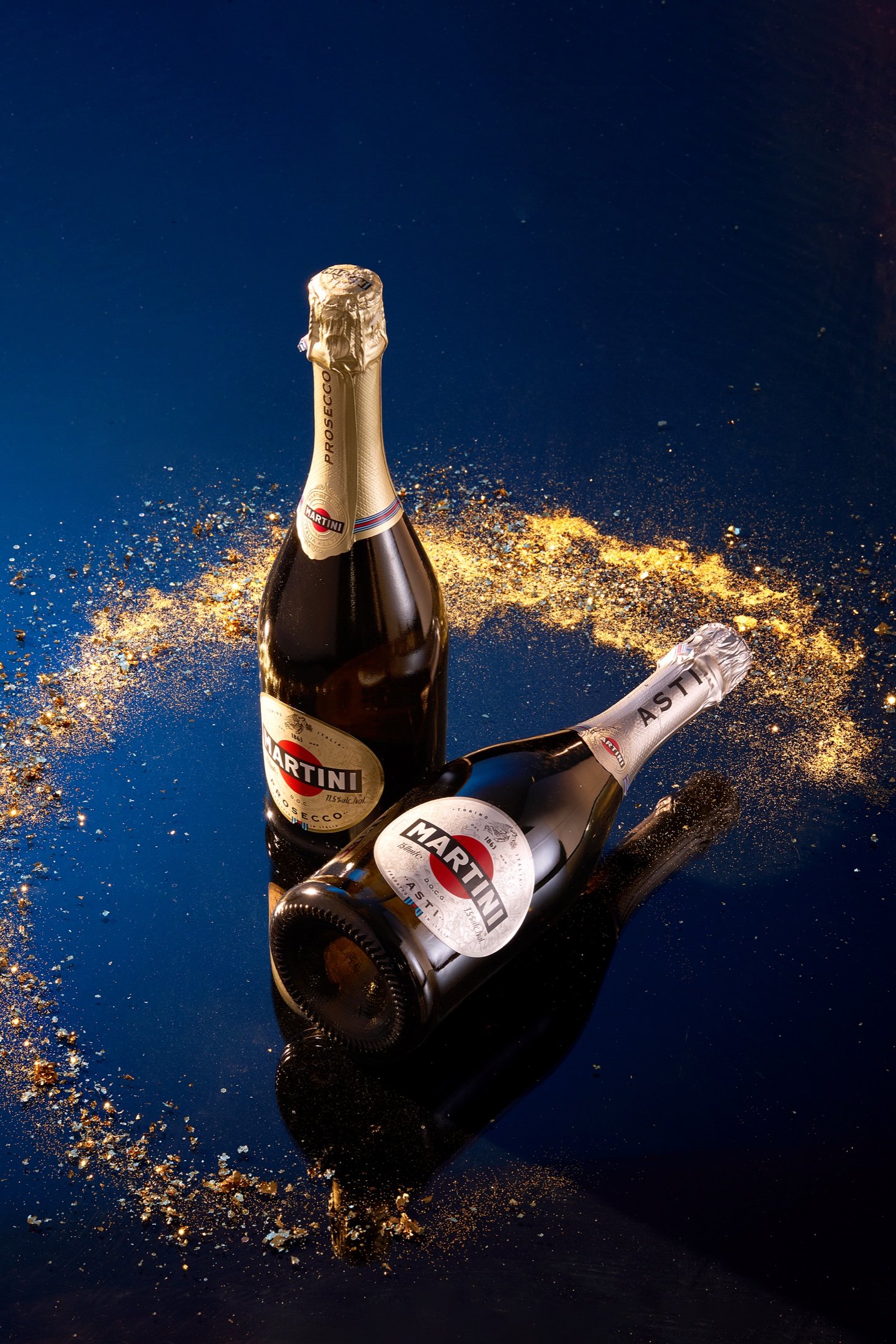 A sparkling bottle photographed with a splash