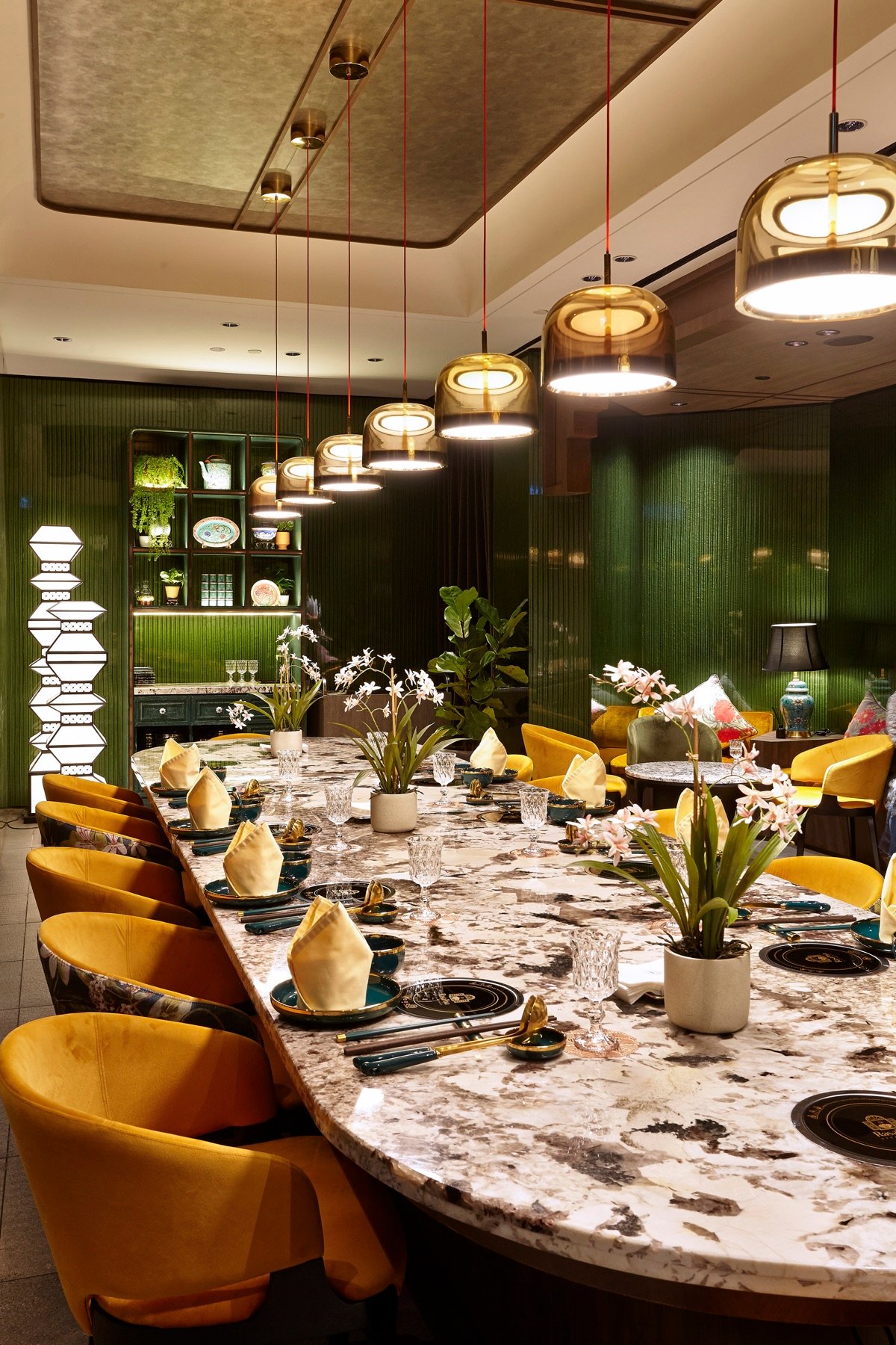 A warmly lit table set for dinner